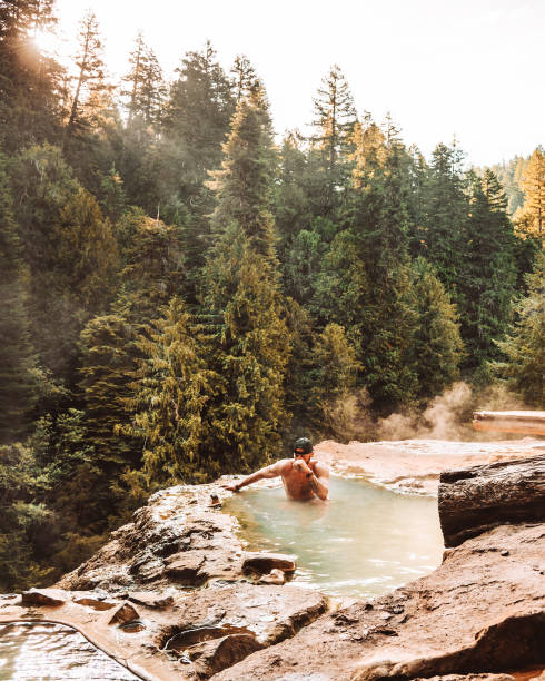 istock man resting in an hot spring in oregon 1413263728