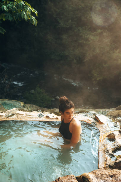 istock woman resting in an hot spring in oregon 1413263778