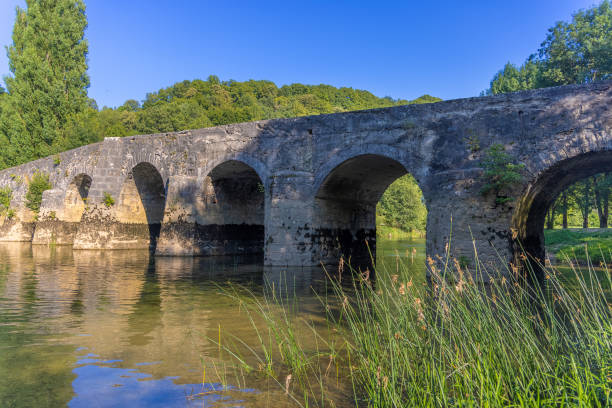 istock The old stone bridge on the Dobra River, Croatia 1413265451