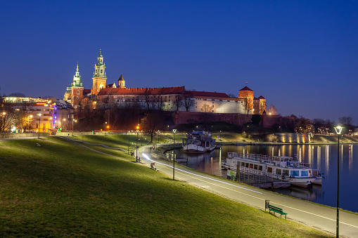 Krakow, Poland - 14 March, 2022: Wawel hill with castle in Krakow at night, Poland