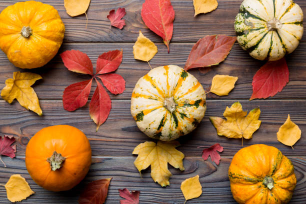 istock Autumn composition. Pattern made of dried leaves and other design accessories on table. Flat lay, top view 1413268550