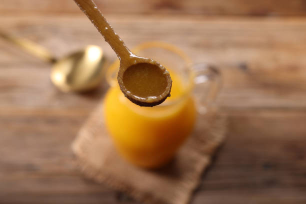 Ghee Butter Oil a traditional Indian Cuisine cooking oil spoon close up