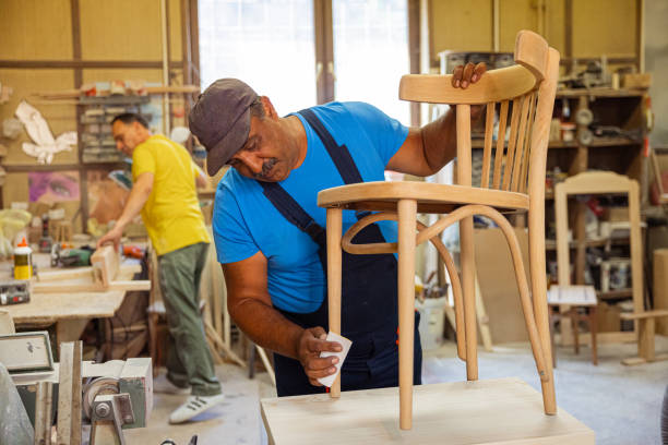 istock Indian carpenter making a wooden chair 1413273237