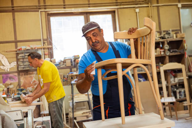 istock Indian carpenter making a wooden chair 1413273271