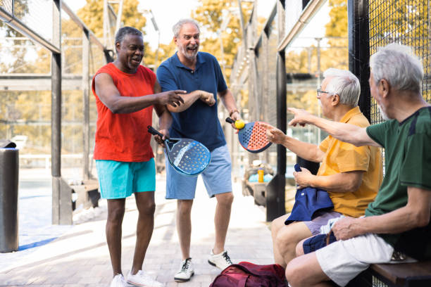 istock Senior friends having fun before playing padel 1413274522