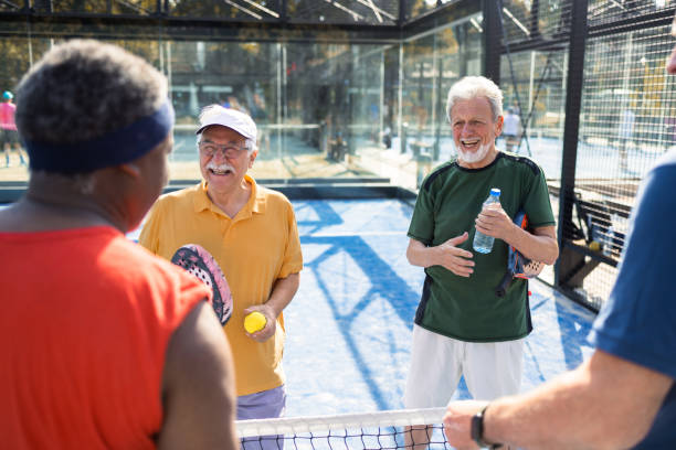 istock Happy seniors playing padel and enjoying together 1413274532