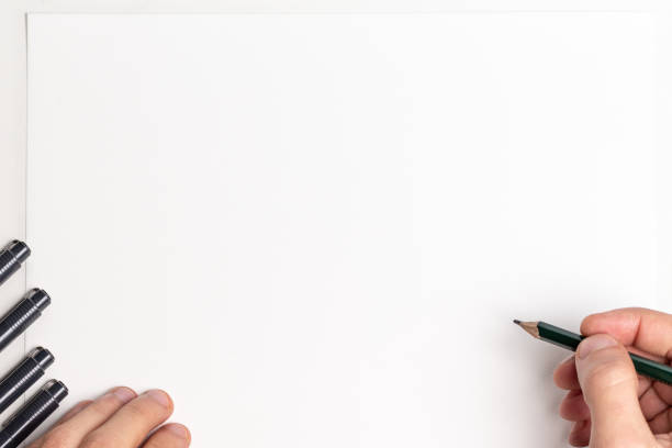 istock Hand holding green pencil over blank paper with copy space 1413278021