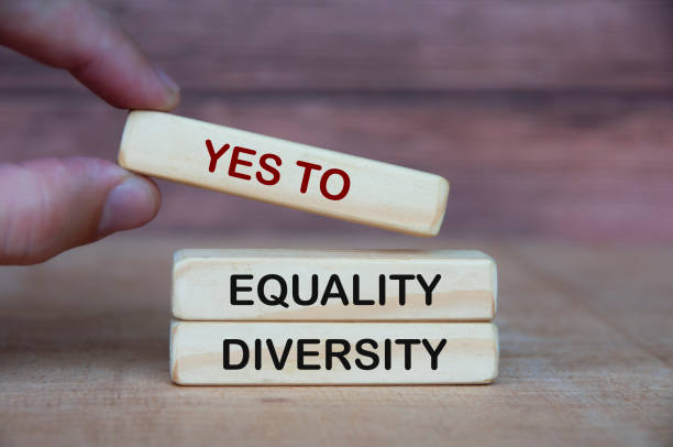 istock Hand holding yes to equity and diversity text on wooden blocks. 1413278828