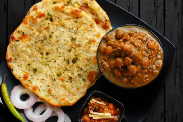 Amritsari Kulche and Chole Amritsari Kulche and Chole or Aloo Kulcha with Choley, Indian Street Food Chole Kulche stock pictures, royalty-free photos & images