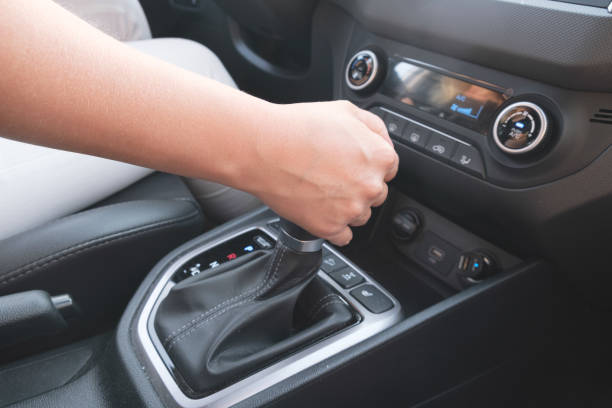 Driver holds on to the shift lever of the automatic transmission