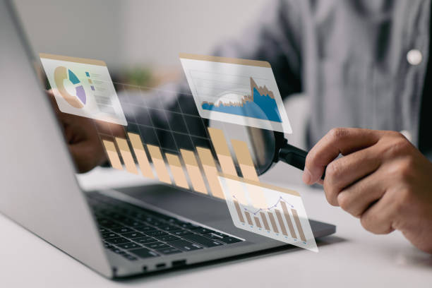 istock Statistical and data analysis for corporate finance and investing concepts with businesspeople on a graph dashboard. 1413283652