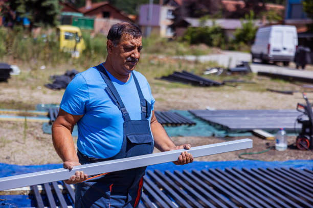 istock Indian construction worker carrying a metal material on the field 1413285343