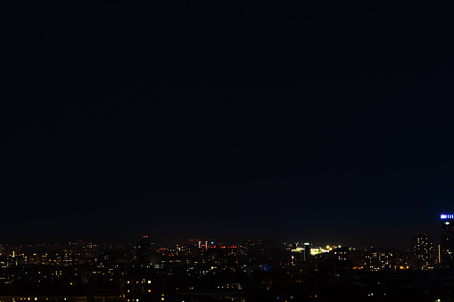 Night sky over the city dark background