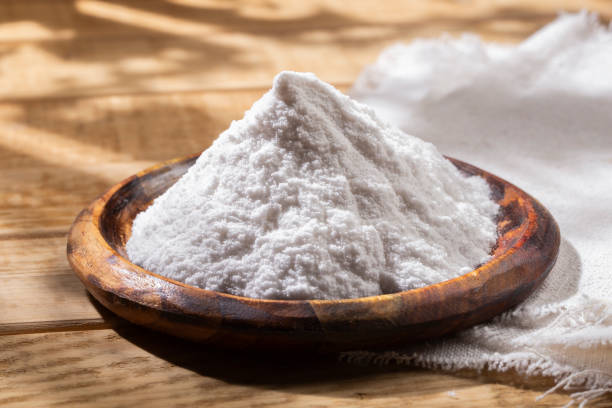 istock Baking soda in wooden bowl on the table 1413286085