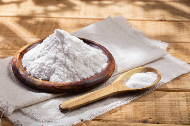 istock Baking soda in wooden bowl on the table 1413286096