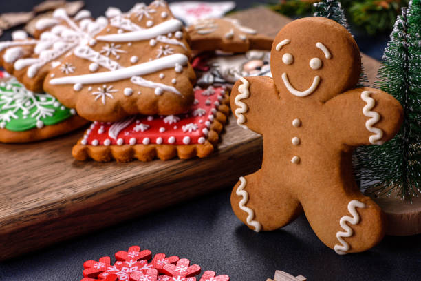 istock Christmas homemade gingerbread cookies on a dark concrete table table 1413288908
