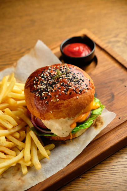 istock French fries next to a burger lying 1413291771