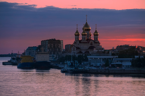 Panorama of the city of Arkhangelsk with the Archangel Michael Cathedral and the port at sunset