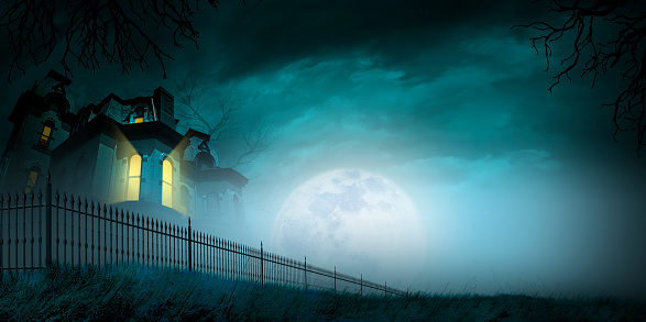 Zombie Rising Out Of A Graveyard cemetery In Spooky dark Night full moon. Holiday event halloween concept.