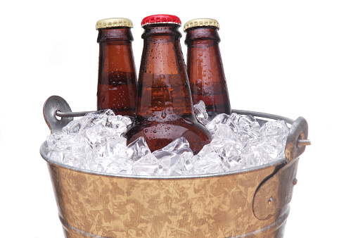Galvanized Bucket with Three Bottles of Beer isolated over white