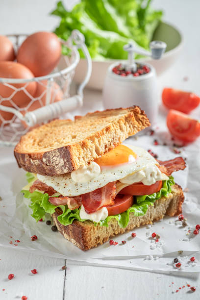 istock Fresh and healthy toasted sandwich with bacon, mayonnaise and egg. 1413295972