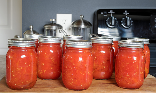 Pints of freshly canned, home-grown, organic, crushed tomatoes.