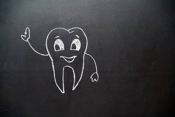doodle tooth with smile drawing on blackboard