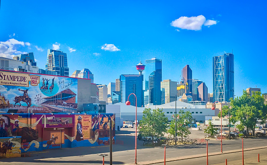 View from the Stampede Grounds on downtown Calgary, Alberta. Picture taken in summer 2017.  In the picture we also see a large mural at the stampede entrance by Penny Corradine, made in 1997.