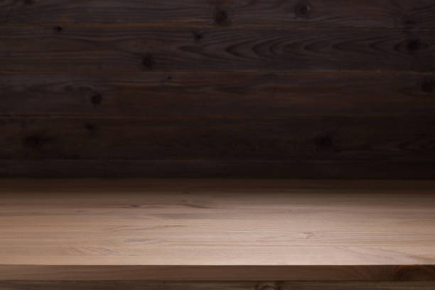 istock Wood table top background texture.  Wooden tabletop front view 1413299588