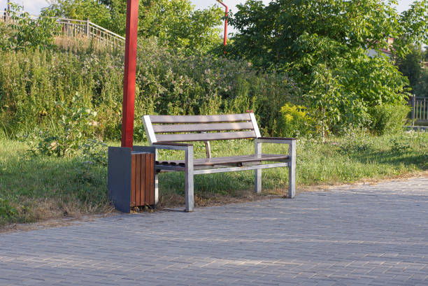 istock one empty brown wooden bench and urn 1413300352