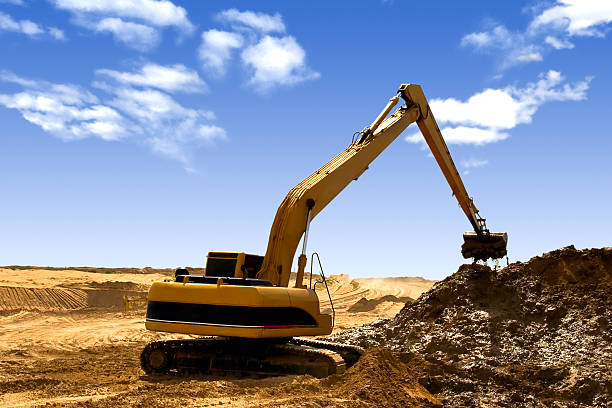 istock Orange excavator  at Construction irrigation canal in Desert 141330249