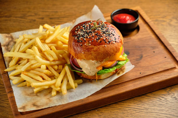 istock French fries next to a burger lying 1413302944