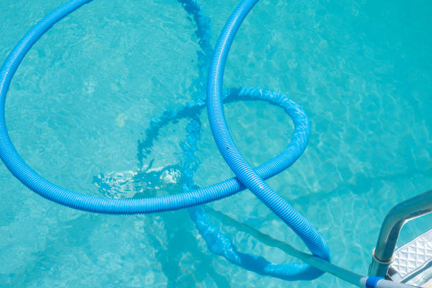 istock vacuum cleaning hose for a swimming pool 1413303160