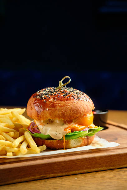 istock French fries next to a burger lying 1413305813