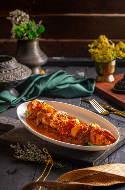 istock Tawa Jheenga or fried shrimp with gravy served in a dish isolated on dark background side view food 1413306468