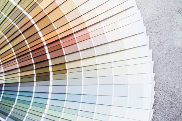 istock Multicolor paint samples - color swatch for interior design. Gray concrete cracked background 1413307075