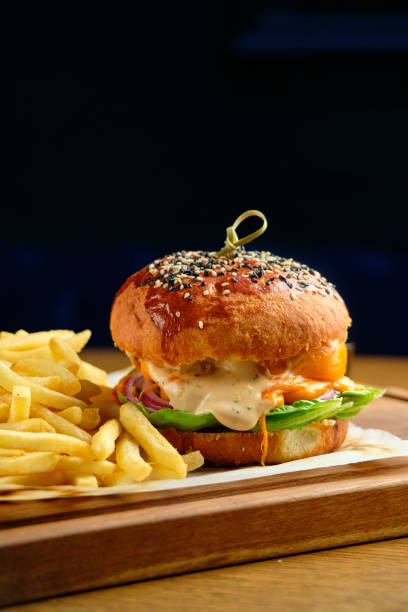 istock French fries next to a burger lying 1413309247