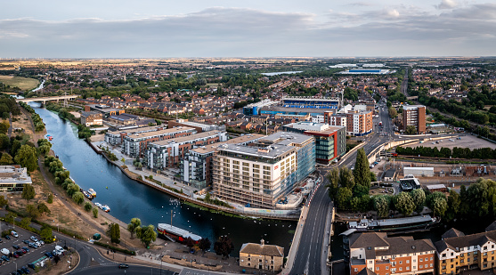 Peterborough, UK - August 4, 2022.  An aerial view of The Fletton area of Peterborough including the River Nene and The Weston Homes Stadium home of Peterborough United Football Club