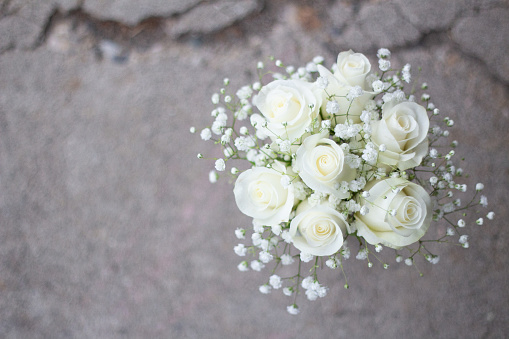 Small bridesmaid bouquet with white roses and baby's breath