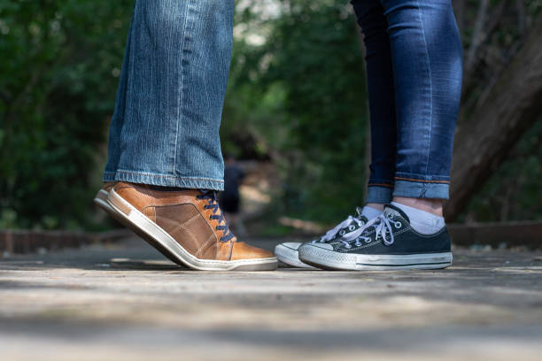 istock Kissing Shoes, man on tiptoe 1413320437
