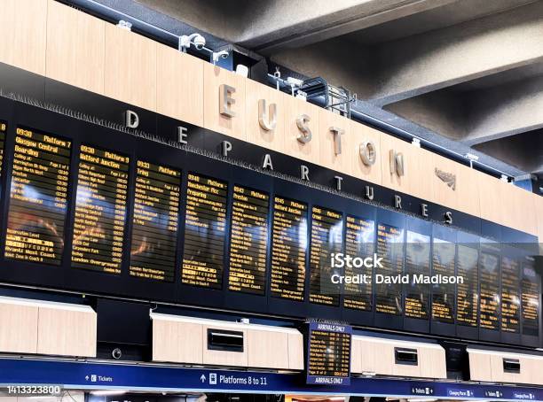 Train Schedule Sign With Departures And Track Numbers Stock Photo - Download Image Now