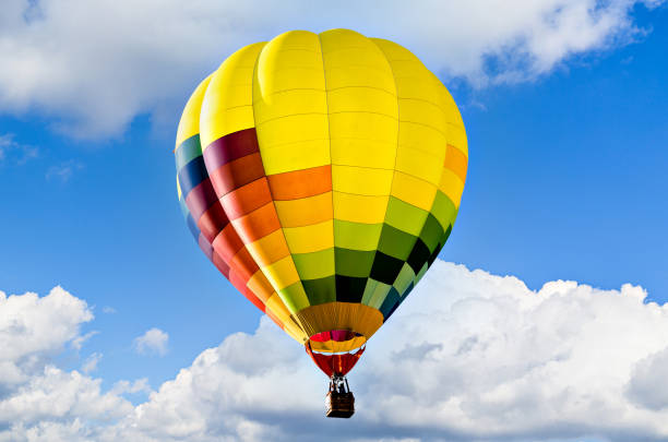 istock Hot air balloon flight over blue sky 1413325417