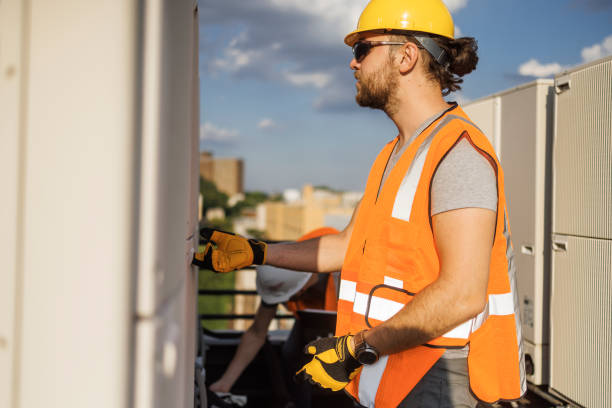 istock Working on a rooftop to fix an air conditioner. 1413326465