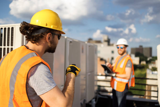 istock Rooftop air conditioning unit inspection. Supervisor and worker checking air condition system and logging results with a portable computer. 1413326474
