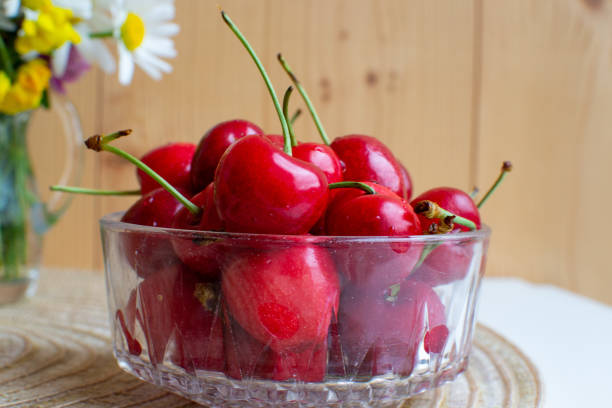 cherry macro, berry season, summer berry season, cherry berries in a glass bowl