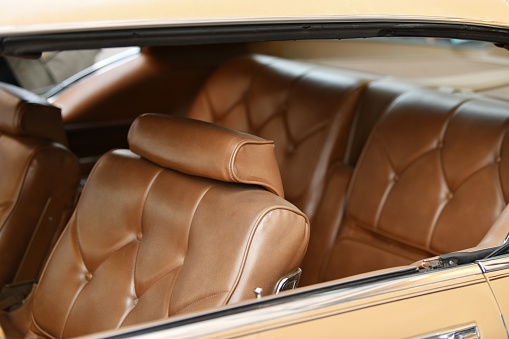 Brown vintage armchair in a car interior