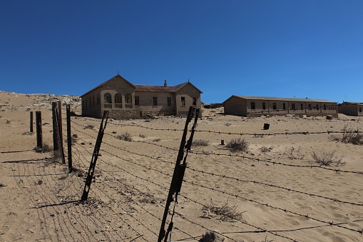 Deserted homes in Kolmanskop ghost town near Luderitz in Namibia, the site of an abandoned diamond mine
