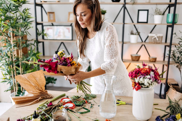 istock Woman making floral decorations 1413331107