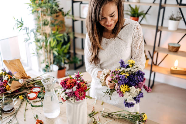 istock Woman making floral decorations 1413331633