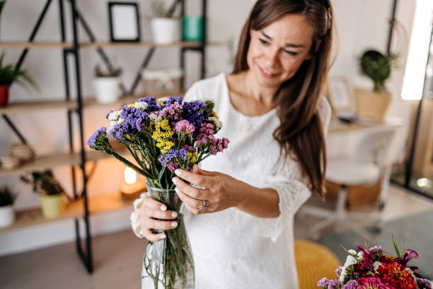 istock Woman making floral decorations 1413331685